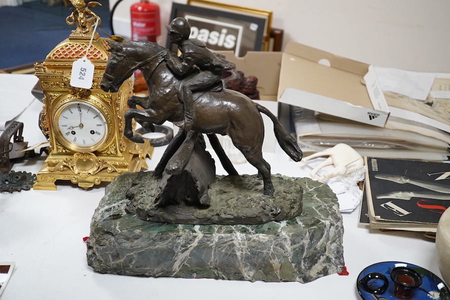 June Harrah (American), bronze group of a racehorse and rider, on a naturalistic green marble base, 30cm high, with paperwork including provenance and exhibition leaflet. Condition - good